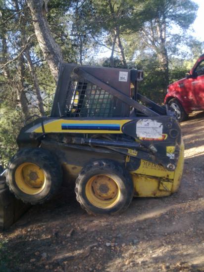 lote de 4 maquinas minicargadoras new holland con retro y martillo